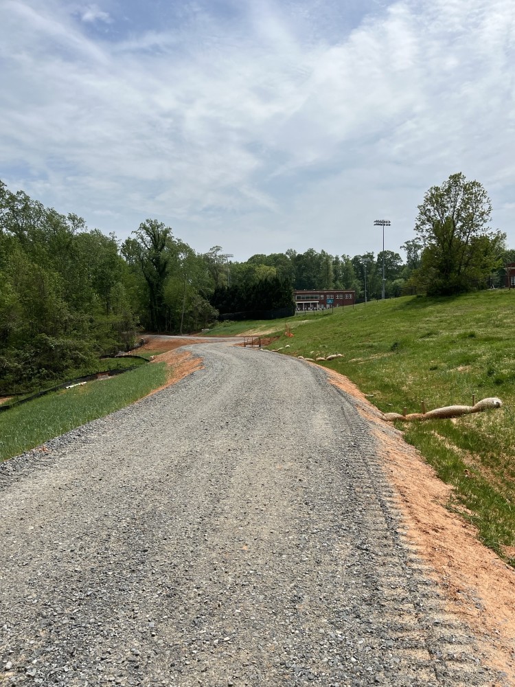 Image of Little Hope Greenway behind Queens fields.