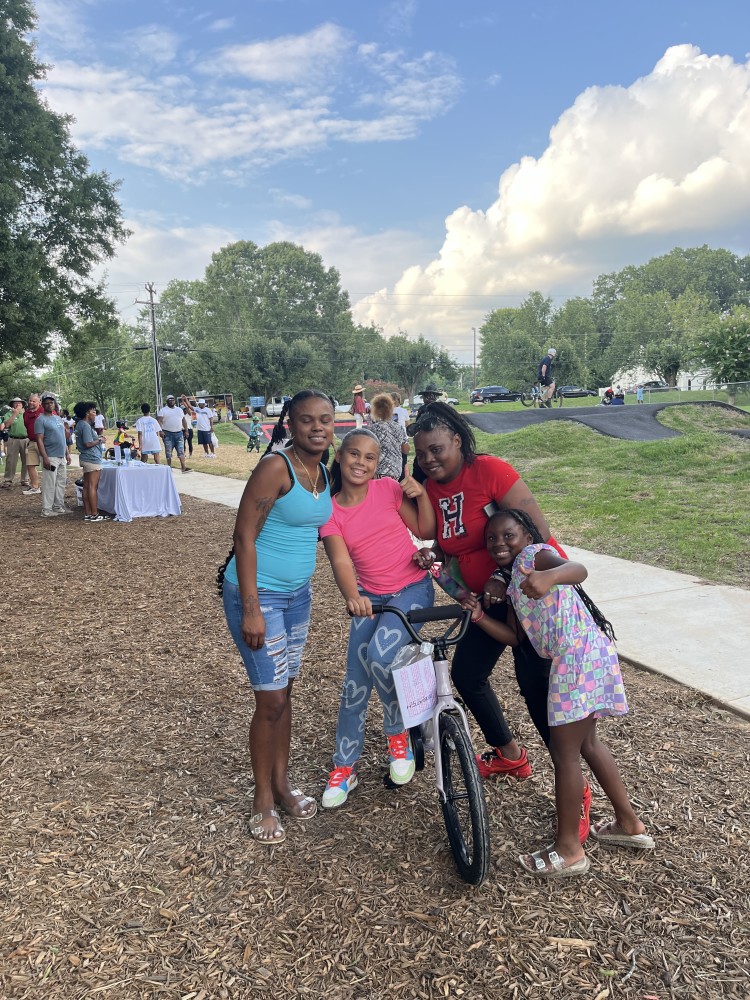 Winner of bike raffle at Fred Alexander Park opening.